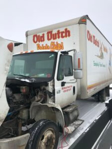 A truck that has been hit by another truck.