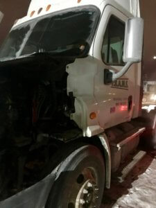 A truck that has been hit by a car.