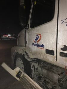 A white truck with the letters punjab on it.