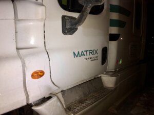 A white truck with the words matrix on it.
