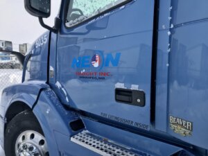 A blue truck with the words " weow " on it.