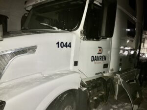 A white truck with the name " davern ".